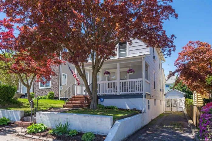 Move right in to this warm and inviting Colonial with front covered porch in the heart of Port Washington! Situated one block from Main Street, you can easily enjoy all of the conveniences of nearby shops, transportation, and 2 local town beaches with tennis, basketball, skate park, playground, pool, kayaks & more. The LIRR Station is a quarter mile away, making this home a commuter&rsquo;s dream, while still being a suburban oasis with backyard to relax and entertain. The sun-filled, updated kitchen boasts vaulted ceilings and flows easily to the separate dining and living spaces. Upstairs, you&rsquo;ll find an updated full bath, the primary bedroom with custom built-in closets, and a spacious second bedroom. The full, unfinished basement space with laundry is a great place for potential home office, home gym, or additional storage. Rear entrance with mudroom leads to fenced backyard with paver patio and detached garage. Don&rsquo;t miss this incredible opportunity and come see this home for yourself!