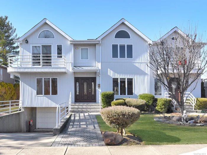 Beautifully Updated Colonial In Manorhaven. Full XL Finished Basement With .5 Bath, Living Room/Fireplace, Master Bedroom With Vaulted Ceilings And Balcony With Water View.