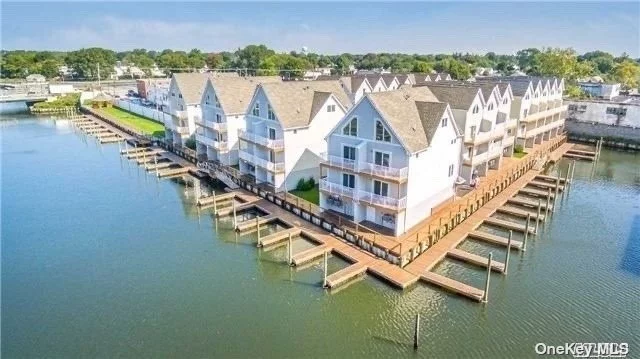 :Yachtsman&rsquo;s Cove is a 5-Year Young New Construction Waterfront Condo Development Featuring 3 Levels of Living Space! This is the end corner unit!!-including- living room, formal dining room, kitchen, 2-3 bedrooms, 2.5 bath, bonus room, 2 balcony&rsquo;s overlooking canal, 2 car garage w/ back deck, private deeded boat slip, open floor plan w/ hardwood floors, central air conditioning, gas heating & cooking, laundry service on bedroom level. Gorgeous!!..1545 Sq feet .A beautiful outdoor area w/green space & gazebo, 5 guest boat slips & so much more!