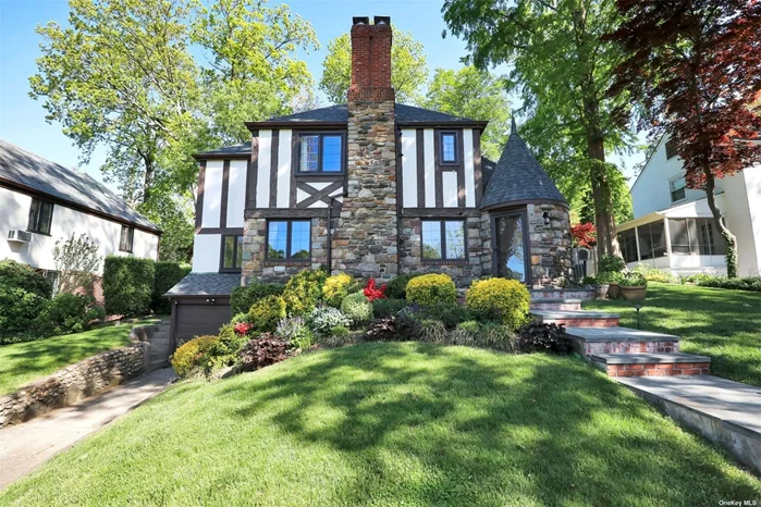 Welcome to This Uniquely Expanded and Renovated, Sunlit Tudor in the Heart of North Strathmore on an Oversized Property. The Turret Entrance Leads to an Entry Foyer Boasting Beautiful Wood Floors Throughout. The First Floor Features a Formal Living Room with a Wood Burning Fireplace, a Formal Dining Room, a Gourmet Kitchen with Wolf and Subzero Appliances, as well as a Cozy Den, Sunroom, Bonus Room, and Bedroom with 1.5 Baths. The Second Level Includes a Principal Bedroom Featuring a Gorgeous Bath with Stand Alone Tub, Radiant Heat and Two Large Walk In Closets, In Addition to Three Bedrooms, and a Full Bathroom. The Lower Level is Finished and Includes an Office, Spacious Playroom, Laundry Room, and Plenty of Storage. Newer Roof with Warranty, Converted to Gas, Manhasset Train and Schools.