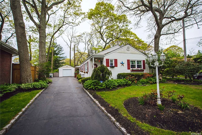 Brightwaters Ranch with beautifully manicured landscaping. Featuring Living Room, Formal Dining Room, Eat in Kitchen, three Bedrooms & a Full Bath. Hardwood floors throughout, updated windows and a one car detached garage.