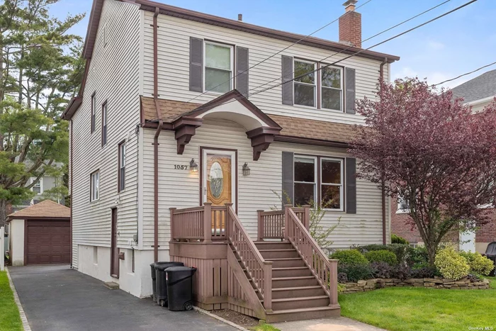 Classic side hall colonial on quiet street in Woodmere. 3 bedrooms and 2 full baths upstairs, full basement, nice yard.