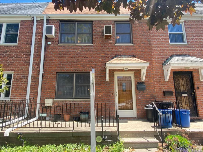 Solid Brick Attached Colonial on a Great Block in Bayside! School District 26. Well Kept and Sunny Rooms Throughout. Main Level presents LR, FDR, EIK, 1/2 Bath. 2nd Level presents 3 Bedrooms, 1 Full Bath. Full Walk Out Level Basement w/Family Room and Sep Entrance. 2 Car Garage. Very Convenient to Transportation and Shopping!