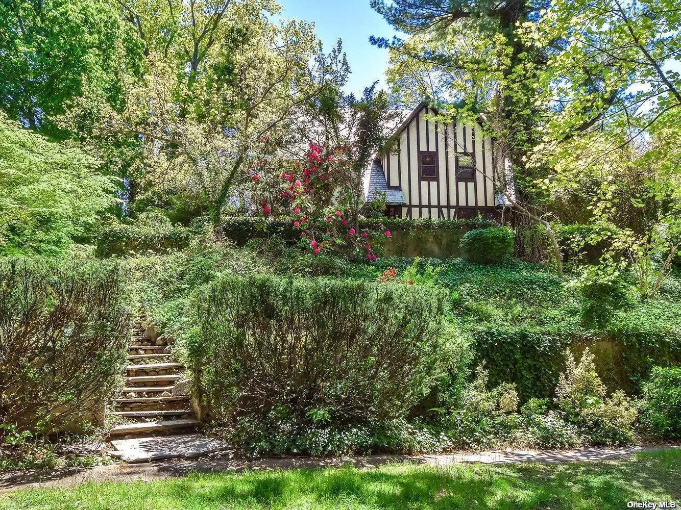 Welcome to this classic English Tudor located in Beautiful Port Washington Estates. Center entry foyer into LR w/window seats and WB fireplace. French doors open to 20 x 20 Family Room and Formal Dining Room with French door to patio. Eat-in kitchen with Carrara marble counters. Built in buffet. Mudroom & pantry. 1st floor office. Powder room. 2nd floor Primary Br w/bath, sitting room & door to balcony. Addit. 2 BR&rsquo;s and bath. Full third floor bonus space. Walk out basement. HW floors. Ductless AC. 75 gallon gas hw heater. New 2 zone gas heat. Slate roof. Beach & Mooring rights w/association fees.