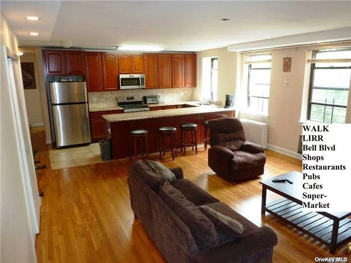 Very Spacious, Totally Open Concept, Kitchen and Living Room in a Smartly Updated 2 BR. House Size Kitchen Features a Huge, 12 foot Granite, &rsquo;Sit-Down&rsquo; Counter. Lots of Cherry Wood Cabinets and Stainless Appliances Completes a Great Kitchen for Cooking or Entertaining. Walk To LIRR, Bell Blvd Shops, Restaurants, Buses. Quiet and Bright, Top Floor W King-Size MBR. Hardwood Thru-out and Unusually Large, Updated Bath. The LR is Big Enough For 3 Couches and Ten Friends. Recessed Lights and Good Size 2nd BR in a Courtyard Setting. NO Flip Tax, In-Ground Pool Club, Laundry Room, Bike Room, and Storage Room Available. School District 26 -ZONED FOR PS203! Close to 4 Highways, WALK To: Beautiful Oakland Lake, Alley Park, LIRR, Q12, 13, Q27, 31, XBus QM3 make for an EZ Commute. The Best OF City and Suburbs, Come and Enjoy All This NORTH BAYSIDE 2BR Has to Offer!