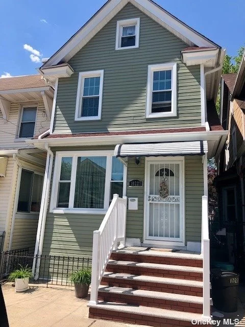 Lovely Detached One Family with New siding, New Roof (2019) New Windows (2021) New heating system. Well maintained Colonial with hardwood floor, big basement, huge private yard. Steps from Forest Park, 3 blocks to the J Train. 20 Min ride to Rockaway beach.