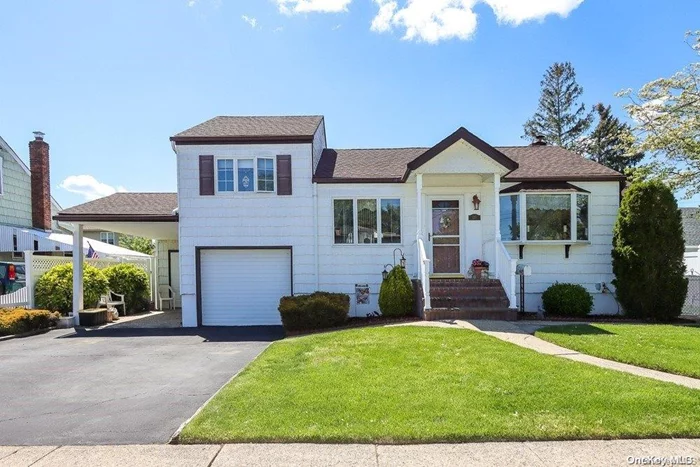 Welcome Home to This Clean and Bright Beautifully Maintained Split Level Mid Block Location on a Quiet Street. Possible mother/daughter with proper permit. Updates Include 1 Year Old Roof, Hot Water Heater,  Economical 4-zone Oil Burner, Remote Water Filtration System, 200 Amp Electric Service, Brand New Stockade Fence. Exhaust Fan in Attic. . Beautiful Sunroom Looking Over Spacious Backyard. Oversized 70x100 Property. Close Proximity to Park, Shopping and Train. Taxes have never been grieved. With star taxes 11629.15