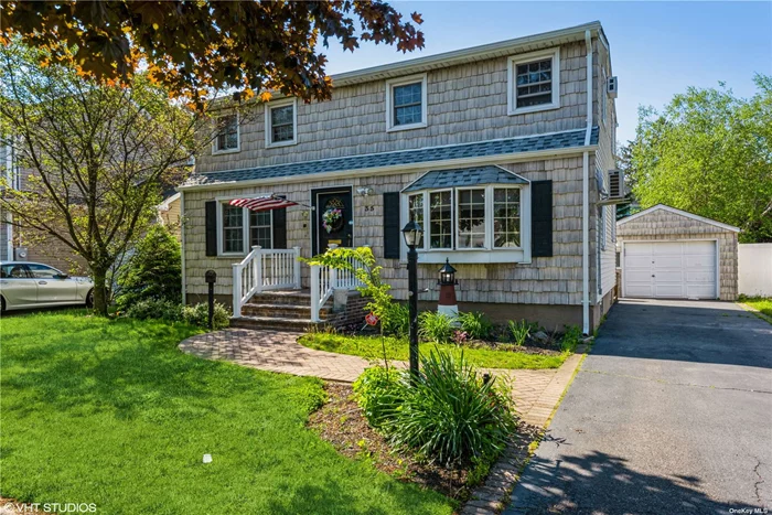 Beautiful, mid-block, 5 bedroom, 2 bath Colonial located in Bethpage on a quiet tree lined street. Hardwood floors throughout. 1 bedroom on first floor, 4 bedrooms on the 2nd floor, Detached garage, large fenced in yard and plenty of room in driveway for parking. Perfectly located within walking distance of the elementary school, playground and close proximity to stores and highways. Updated kitchen, new roof. This house is a must see!