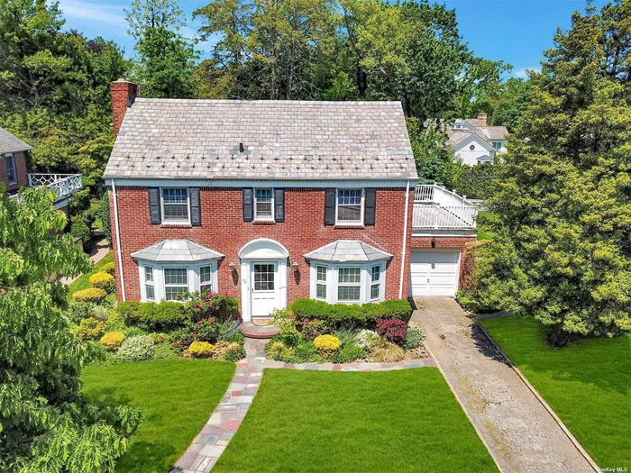 This 3 bedroom, 2.5 bath brick CHC sits beautifully on large, flat property on one of the most sought-after streets in the Village of Plandome Heights. First floor offers well-appointed principal rooms including living room with wood-burning fireplace, inviting den, formal dining room, half bath, and cozy eat-in kitchen leading out to a lovely bluestone patio overlooking picturesque backyard. Second floor features primary bedroom with en suite bath, two additional bedrooms and full bath. Endless possibilities to make this home your own, truly a special opportunity! Close to town, parks, and LIRR, you can fully enjoy all Manhasset has to offer in this timeless home.