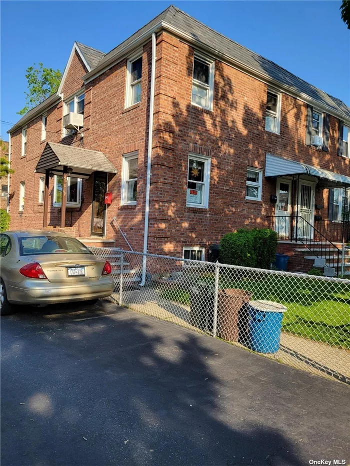 Attractive, Large Two Family Semi-Detached Corner Brick Home For Sale with private fenced backyard. Two Bedrooms over Two Bedrooms. Separate Entrance for both apartments. Semi-finished large basement. SD # 26. Close Proximity to Bayside LIRR station and local/express buses & shopping nearby.