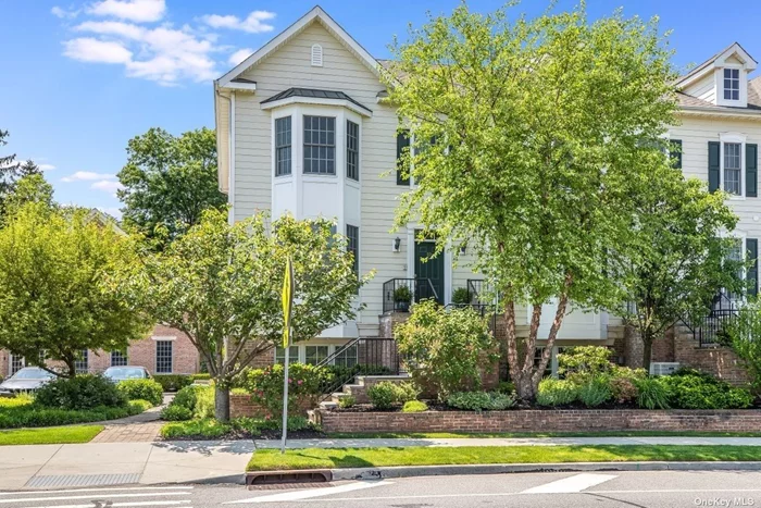 Abundant natural light floods this beautifully maintained, 3-floor end-unit townhouse situated in the heart of historic Oyster Bay. The open plan on the middle floor offers high ceilings, stainless steel appliances, granite countertops, a kitchen island, a gas fireplace, a west-facing balcony and multiple dining/seating options. Upstairs, the master suite features coffered ceilings, 2 closets and a bathroom with separate shower/tub areas and double sinks. The 2nd bedroom has its own full bath and closet. The lower floor can be used as an office/recreation space, houses laundry room with full size washer/dryer and provides access to house via a heated two car garage. Elevator installation possible, space now used for extra storage. On-site clubhouse with gym, common room and outdoor seating. Near shops, restaurants, beaches, marina and waterfront park.. Easy access to major roadways. Assessment of $250/month through 8/2022 in addition to monthly common charges.