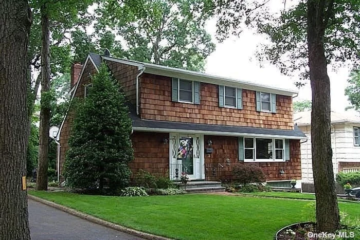 Nestled in the heart of a waterfront Village is this mint condition Colonial. Warm and inviting with beautiful updates including: Renovated kitchen with Cherrywood cabinetry/Stainless Steel Appliances and Granite countertops with additional area for serving. Renovated Bathrooms, New Anderson widows, Formal Dining Room with moldings, Spacious Living Room, Cozy Den with corner brick fireplace, Spacious Master Bedroom, Finished Basement, Garage, CVAC, CAC, SS. Whole House Water Filter, New Oil Tank, Village Beach and Mooring rights. LV SD, Not flood zone