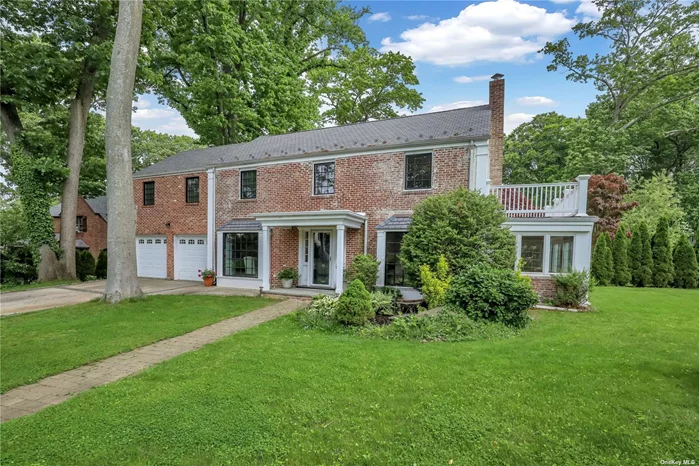 Introducing this 6 Bedroom, 3 Full Bath Corner Colonial located in North Strathmore. This elegantly appointed home offers charming old world architectural craftsmanship throughout. The sun drenched foyer ushers you into this classic residence while highlighting its principal formal rooms. Hardwood floors throughout only enhance the understated elegance of this home. The formal living room is warmed by a wood burning fireplace and gives entre to a glass enclosed sunroom. There is a first floor bedroom with a full bath nearby. The gourmet kitchen also accesses a stone patio for alfresco dining and entertaining. The second level features a Master Bedroom en suite with private balcony overlooking the well manicured yard. There are 4 additional bedrooms waiting for you to customize. The lower level boasts spacious, fully tiled recreational areas or quiet spaces to relax. CAC, Two Car Attached Garage, Munsey Park Elementary. This home is destined to find a new owner soon!