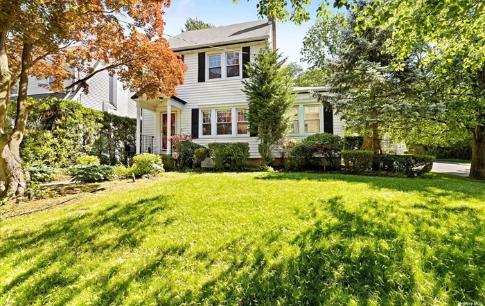 This charming home located in Manhasset offers 3 Bedrooms, 2.5 bathrooms,  hardwood floors throughout, living room with fireplace, formal dining room leading to an outdoor patio, kitchen with breakfast nook, a beautiful sunroom, finished basement and finished walk up attic. Situated on a corner lot with a fully fenced in backyard, a detached garage and private driveway. Located near LIRR and zoned for Munsey Park Schools.