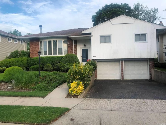 Move Right In 5 Bedroom, 3 Full Bathrooms On A Quiet Residential Street In SD#15. Features Formal LR W/Fplc, Formal DR, Expanded Eat-In-Kitchen, Gas Heat, Central Air Conditioning, IGS, Hardwood Floors, High Hats, Many Closets..