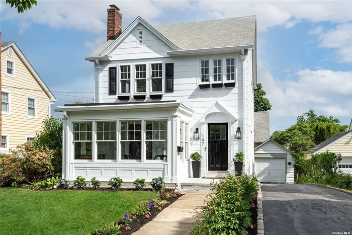 Move right in and enjoy easy living and an open floor plan at this completely renovated 1926 Colonial. This sun-drenched 3 bedroom 1 full 2 half baths residence located on a beautiful tree-lined street in the heart of Manhasset. Convenient to town, train, library and shopping.