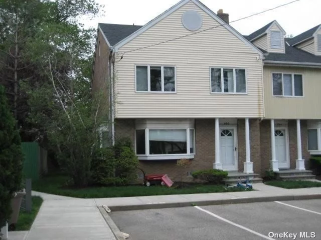 This corner unity has extra lighting and a side and back yard with deck area. Spacious Townhouse In Heart Of Cedarhurst Low Taxes & Maintenance .Xlarge Master W/Walking Closet.Full Stand Up Attic. Can Be A Playroom.Lots Of Storage. Sliding Doors To Deck. Must See