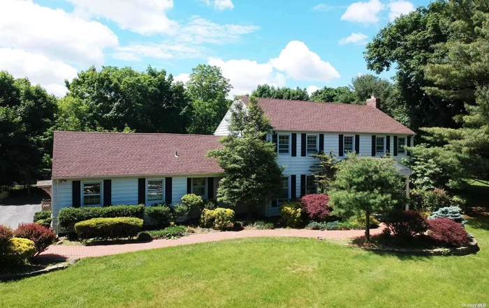 This magnificent colonial is on 2 acres of beautifully landscaped flat land. Private cul-de-sac with marvelous in-ground pool. A large foyer leads to an elegant living room, formal dining room and eat-in-kitchen that looks out to a brick patio. Also on the 1st floor- a cozy family room, sunroom with views of the pool, and a guest bedroom with full bathroom. The master bedroom+bath, 3 bedrooms and another full family bathroom are on the 2nd floor. Recently replaced roof, hot water boiler, and furnace. Location is everything with this lovely home, in the prestigious Muttontown neighborhood and zoned for award-winning Jericho schools.