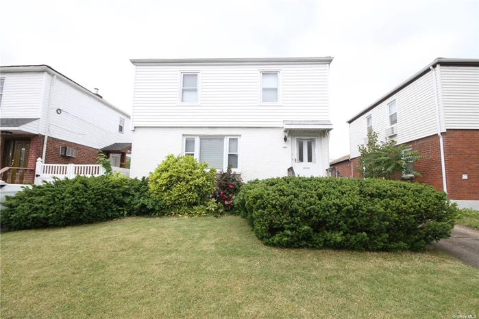 Detached brick and frame colonial on quiet, yet convenient 188th Street; a tree-lined, wide street with easy access to shopping and transportation. The home has 3 bedrooms, a convenient 1st floor 1/2 bath, full finished basement and attic for storage. Close to local buses Q31, Q17, Q30 and Q88. Very easy access to the Long Island Expressway with one block. Zoned for school district #26, PS 162 and JHS 216.