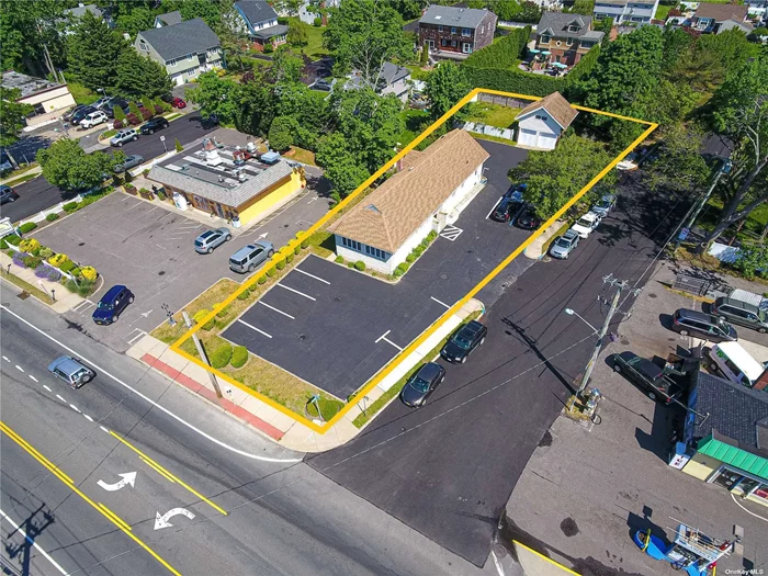 Zoned Business 1, This Office Building Enjoys Tremendous Exposure And High Traffic Count. ADA Compliant. Approximately 1738 Square Feet, Plus A Detached 360 Square Foot Garage With Loft. Utility Basement with Exterior Entrance. Taxes = $ 19, 753.23