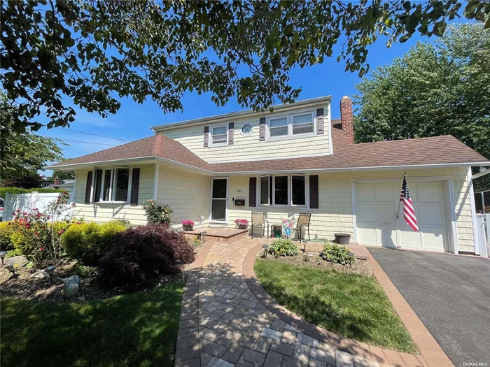 Special Side by Side Legal Mother/Daughter (new owner must file for new permit) in Massapequa Park with 5/6 Bedrooms, 2 Eat-in Kitchens, 2 Living Rooms, Den, 3 updated bathrooms, CAC many updates.