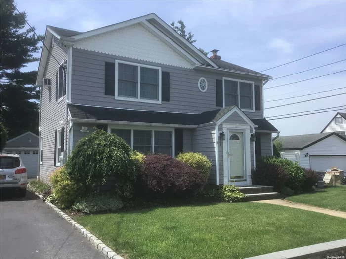 .Move right into this large expanded colonial style home. Hardwood floors thru-out 5 Large bedrooms, 2 baths and large eat in kitchen. Located on a quiet block with beautifully landscaped grounds. Private driveway with 1.5 car garage. gas boiler and cooking. 200am elc.