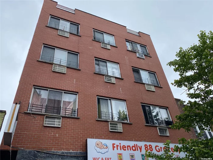 **** great income $219, 000/y.Busy street . Brick Four stories plus basement. High income generating mixed use with 5 residential units( 4x 2BEDRM+1x 3BEDRM 2 FBATH ) and 1 store front ( 2500sq) .tenants pay their own heat ..building 31x83. built in 2005. Low tax . 6 gas meters and hot water tanks. 7 electrical meters.one block to the busy Roosevelt Ave, subway 7train . Commercial unit pays portion of prop tax. All information Deemed Accurate However should be Independently verified.