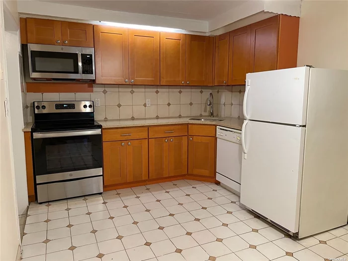 Pet friendly, spacious apartment with large updated eat-in-kitchen (new cabinets, new stone countertops, new stove & microwave), 2 wall A/C units included. Shared laundry in basement. Storage room. Conveniently located next to Bay Terrace Shopping Center. Shops, movies, pool, restaurants, Clearview Expwy (to LIE & GCP) Cross Island Pkwy, Q28(at corner) MQ20, Q16. Electric stove and heat. Tenant pays electricity.