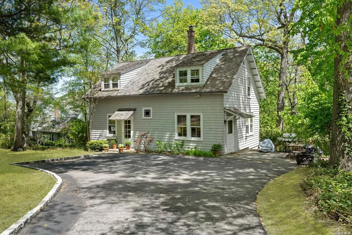 Wonderfully Private Updated 4 Bedroom Cottage On A Serene, Secluded Setting with Partial Water Views. Full House Generator, Snow Removal & Landscaping Included.