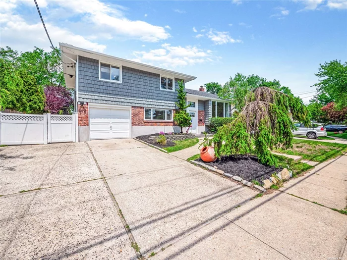 Newly renovated split level house with swimming pool. Close to LIRR and shopping. New kitchen, new baths, new boiler, new HVAC units, new roof, new appliances and more. Must see.