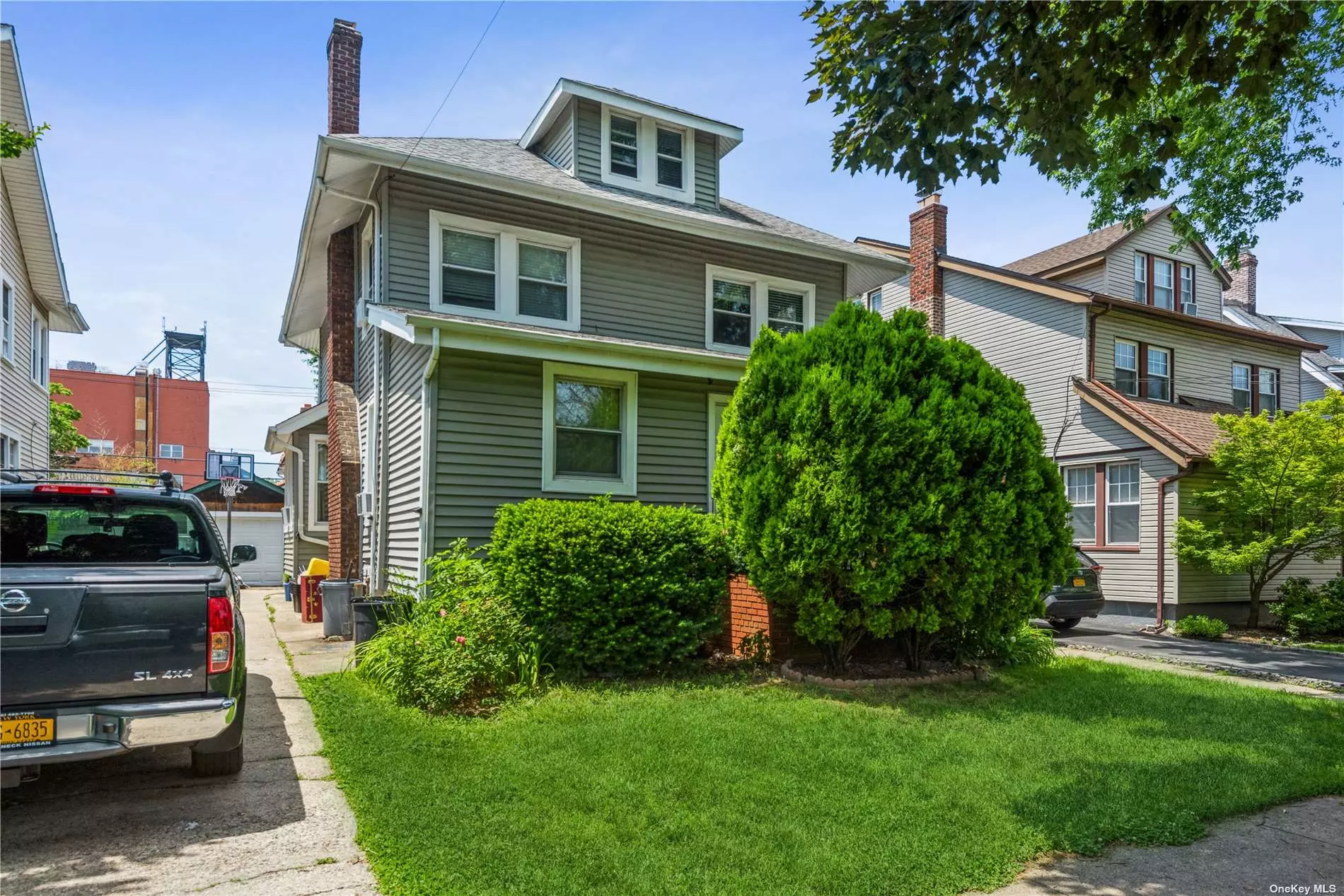 LEGAL TWO FAMILY. WALKING DISTANCE TO LIRR AND CROCHERON PARK! This property is located near the bustling Bell Blvd., Park, Bus and Railroad. This spacious Victorian has three stories and a one car garage. This home also features a finished basement and a fenced in yard. Property is occupied, tenants need 30 days to vacate.