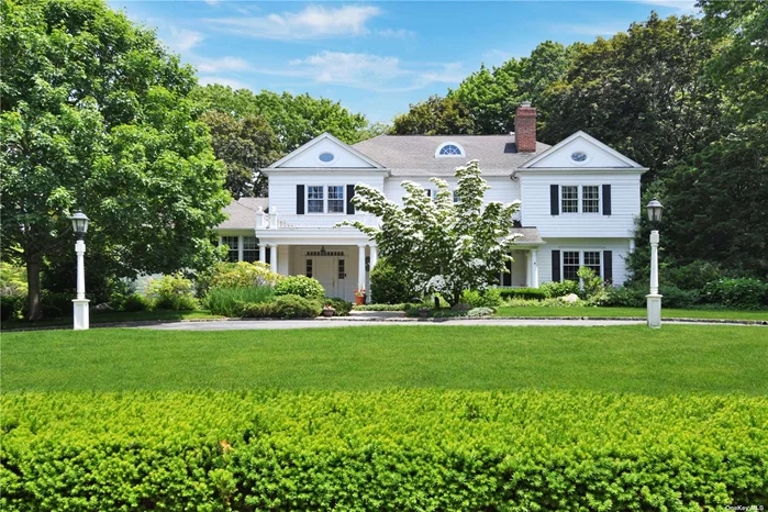 A stately CH Colonial on 1 acre on one of the most desirable streets in Harbor Acres. With spectacular curb appeal and an inviting front porch, this 7 bedroom, 3-car garage home with a full house generator is a must see. The masterfully renovated double story entry way with architectural detail leads to an expansive EIK w/radiant heat floors and a gorgeous cupola and top of the line appliances and an open layout to a family room with gas/wood burning fireplace. French doors lead to your very own secluded bluestone patio. High ceilings throughout the home showcase the dining and living area with wood burning fireplace and a timeless wood paneled den/study. The first level has a primary bedroom suite and two additional bedrooms and bathroom. The second floor boasts another luxurious primary suite with a large WIC, spa like bathroom w/radiant heat floors and a vintage claw foot tub. Two spacious bedrooms and bathroom complete this beautiful home. Beach & Tennis w/assoc dues.