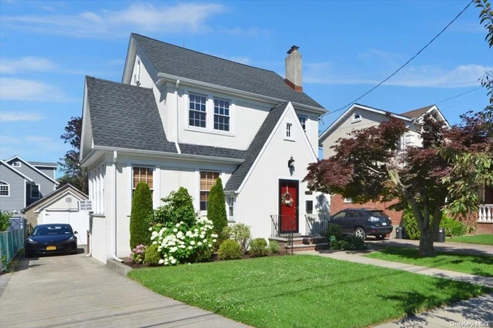 Charming Tudor Colonial House With Spacious Living Rm/FPL & Formal Dining Rm. New Kitchen, Windows, Roof. 4 Bedrooms, 2.5 Baths ! Beautifully Landscape & Terrific Curb Appeal Great Flow Of Entertaining. Exceptional Opportunity ! Prime North Bayside Location ! School District 26. Walk To Shops And Transportation, LIRR (20 Min. To Manhattan).