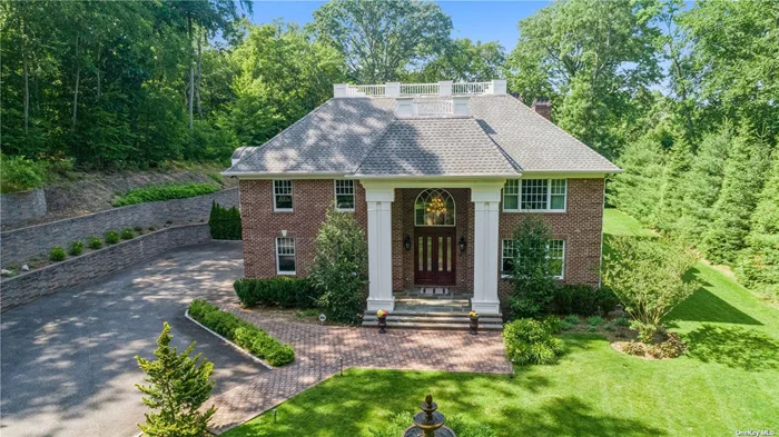 This beautiful brick manor sits on 2+ acres of a lush gated property, the winding driveway through the front acre of property leads to the beautiful front yard with a three-tiered fountain. The 6, 000+ square foot home offers 6 bedrooms, which are all en-suite (one on the main level) and 7.5 baths. Upon entering the 2 story entry foyer the craftsmanship and attention to detail in this home are obvious from the high ceilings on every level, the soaring stone fireplace, the very spacious rooms, the gourmet kitchen with top of the line appliances to the elegant custom mill work and luxurious main suite that has such a gorgeous and relaxing marble bath that you wouldn&rsquo;t want to leave. This state of the art home is also equipped an automation system, video surveillance, radiant heating in all of the tiled areas and is generator ready. Enjoy the outdoors on the blue stone veranda or on the beautiful grounds.