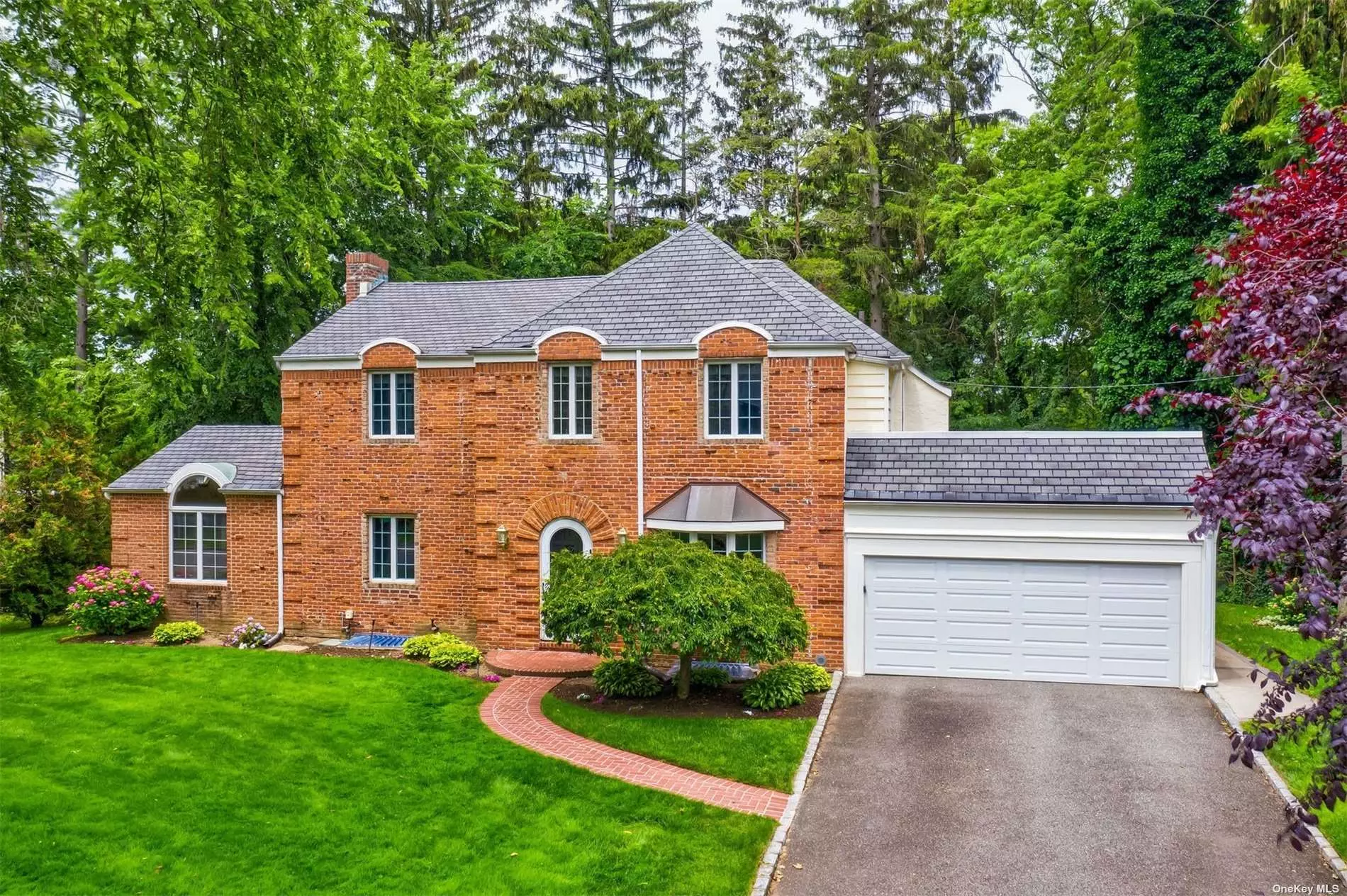 Elegant Center Hall Colonial located on a quiet street in Strathmore Vanderbilt. This bright 4 bedroom 3 bath home boasts spacious rooms with high ceilings, beautiful hardwoods floors, bay windows and French doors. Open foyer leads to a grand living room with a two sided wood burning fireplace, a large den with vaulted ceilings, sky light, sliding doors to raised deck, and an elegant dining room. Kitchen includes a breakfast area and views of the backyard. A well proportioned bedroom, full bath and access to the 2 car garage completes the first floor. Upstairs you will find a master bedroom with a large master bath, 2 additional bedrooms,  hall bath and an office. Close to the gorgeous grounds of Strathmore Vanderbilt Country Club, this home has much to offer!??