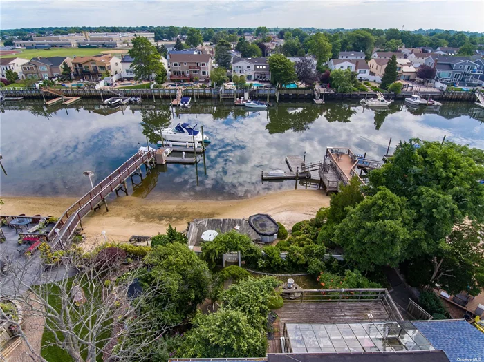 Beautiful, Serene. Selling On Canal with Beach Front, Long Boat Ramp and Above Ground Pool. 4 Bedroom, 2.5 Bath Raised Ranch With Sunroom With Upper and Lower Deck, Lower Bathroom and Fireplace w/2 Car Garage. Great Location!