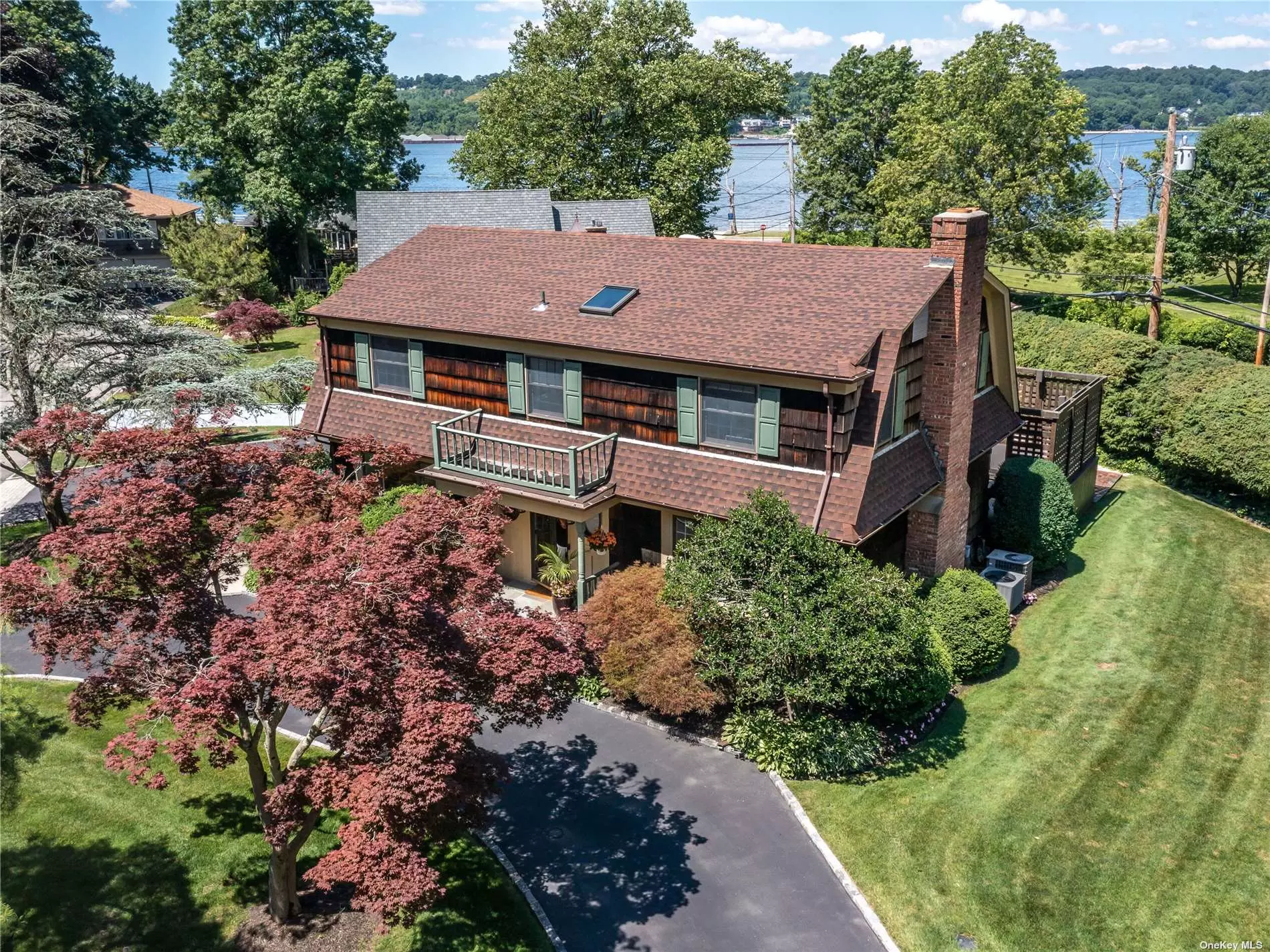 Stunning Water Views greet you as you enter this gorgeous fully updated Colonial. Gleaming wood floors, crown moldings and custom millwork enhance the beauty of every room in this elegant traditional home. Light pours in from large windows front and back and French Doors from the living room and kitchen lead you to an oversized deck and Hot Tub. The Master Bedroom features a water view, 4 large closets a dressing area and full bath with spa tub and shower. Family bedrooms are generous in size and share a bright new bathroom with tub. Pull up an Adirondack chair and take in the beauty of the Glimmering Water and Western Sunsets. This home is located in the sought after town of Sea Cliff where you will find sandy beaches, parks, gourmet restaurants, bars and shops. Award winning North Shore Schools! 35 minutes to Manhattan.