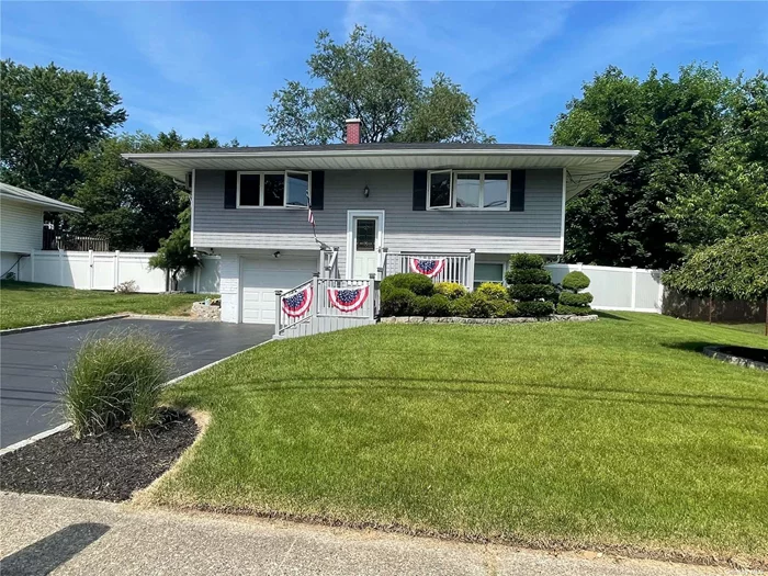 Mint ++ 3-4 Bedroom Hi-Ranch Features 2 Updated Full Baths, Updated Kitchen with Granite Counters, Hardwood Floors, Recessed Lighting, Fireplace, New Separate Hot Water Heater, New Roof, 10 Year Siding & Windows, In-Ground Sprinklers, Front PVC Fence & More!