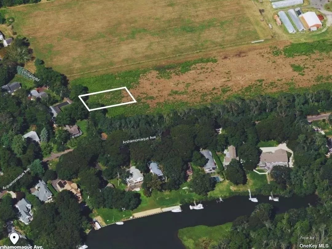 Partially cleared vacant lot in a private community with deeded beach rights