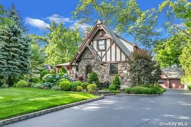 One of a kind large old world charm English Tudor situated in Old Lenox Hills, Inc. Vlg, on top of the hill, features breathtaking curb appeal w/stone & stucco exterior, front patio/porch, LR w/fpl, Banquet FDR w/double Pella French doors to deck, Eat-in Kitchen w/granite counters & walk-in pantry, main level Library/Family Rm w/custom built-ins, main level Laundry Rm or Butler&rsquo;s Pantry, 2nd Flr lg MBR w/large WIC & Office, finished Family Rm Basement w/stone fpl & Full Bath, all Pella windows w/built-in shades, custom crown & authentic moldings, plaster walls, refin. h/w flrs, high ceilings, wainscoting, glass block, stained glass windows, pull-down attic w/hideaway stairs, brand new gas heating sys & sep. h/w heater, 200 amps, det. 3 car gar. w/lg walk-up loft, beautiful tea cottage w/vaulted ceilings, h/w flrs & hot tub, o/s park-like fenced backyard, almost 1/2 acre, custom landscaping, close to Bethpage State Park & Golf Course, close to town, shopping & railroad, Northside Elem
