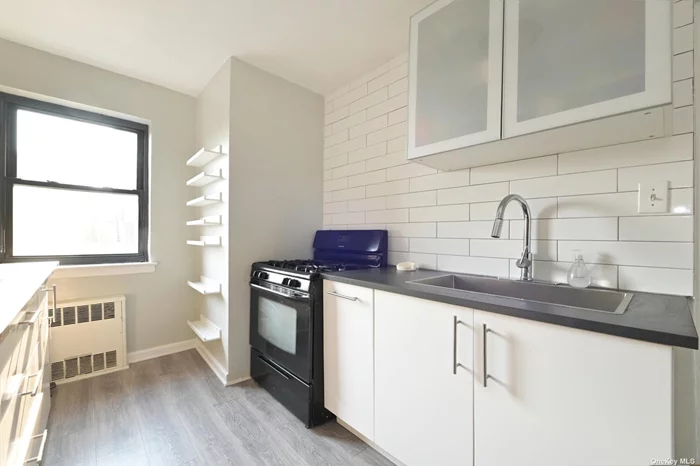 Renovated 1 bedroom apartment with southern exposure, plenty of sunshine, top floor. Featuring hardwood floors and a bath with a standup shower. Close to shops, restaurants and E & F trains, Briarwood station. Water, heat, and taxes are included in the maintenance fee.