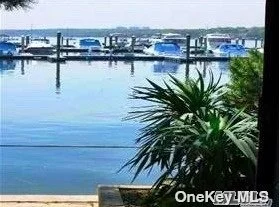 Watch Gorgeous Sunsets & Spectacular Water Views From Almost Every Room Of This Fabulous 3 X 2.5 Waterfront Townhouse In Exclusive Driftwood Harbor Complex! Spacious Open Floor Plan Has Beautiful Kitchen/DR/LR w/Fireplace, Gleaming Cherry Wood Floors, Wall of Window Anderson Sliders to Deck, Laundry & .5 Bath.  Upstairs Has High Celings, Master Suite/Bath w/Sliding Doors to Waterfront Deck + 2 Additional BRs & Full Bath. Finished, Walk Out Lower Level Has Den/Office/Storage & Sliders to Private, Cozy Brick Patio & Private Waterfront Paved Baywalk, Garage & More! Vacation Living All Year Long!