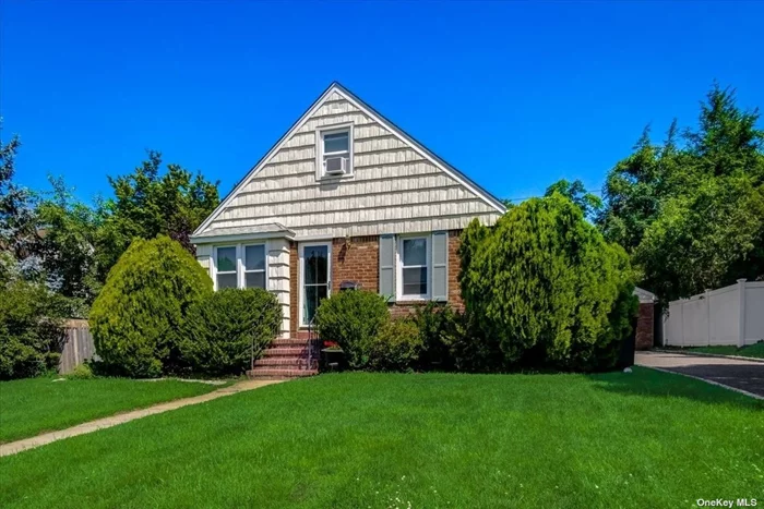 Great beginnings start here in this lovely 3 Bedroom possible 4 Cape. Totally renovated kitchen. Oversized 2 Car Garage Close To Shops, Schools, Lirr, Beaches, Golf courses.