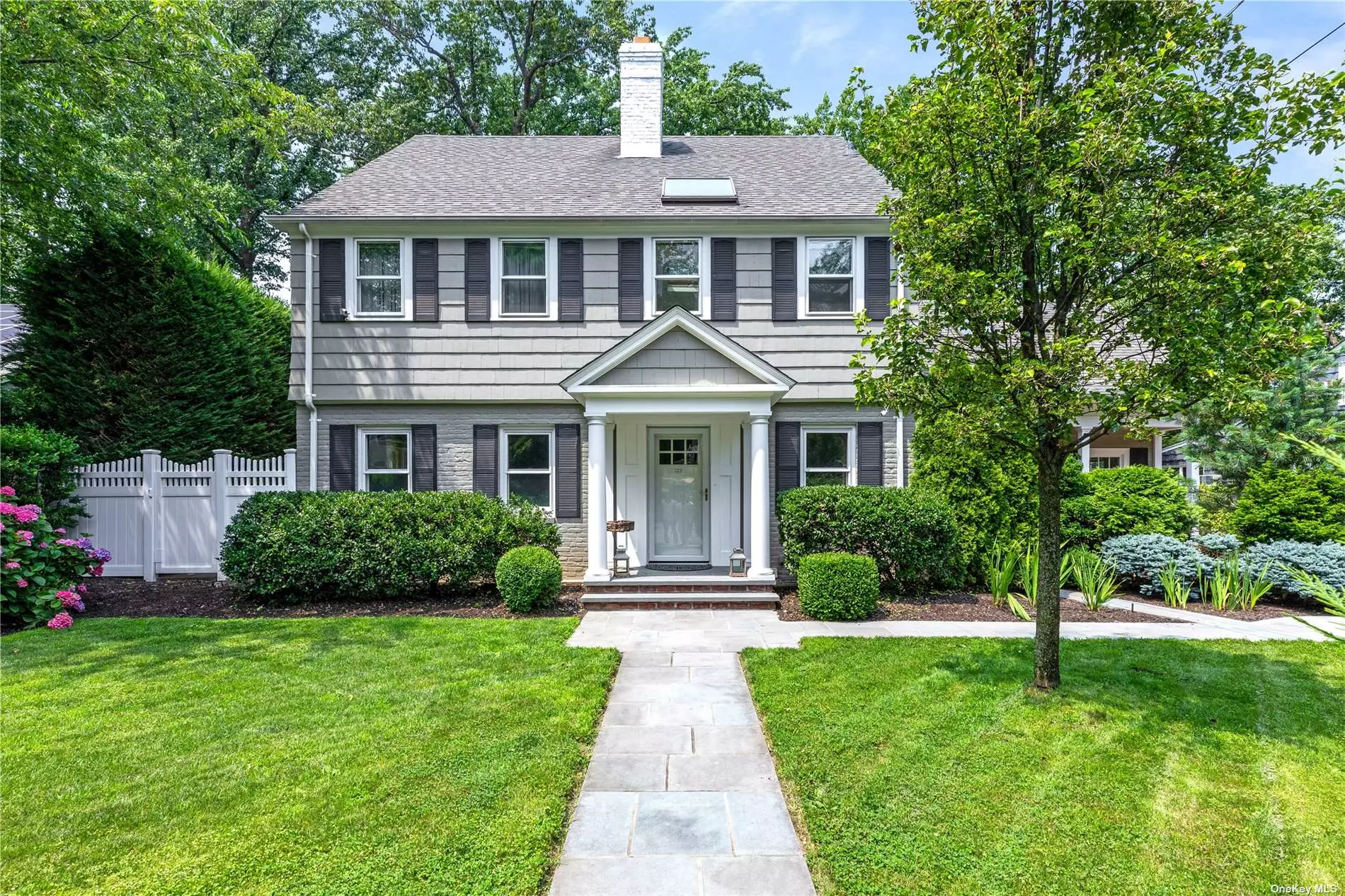 This beautifully redesigned five bedroom, 3.55 bathroom Brick and Shingle Colonial is located on Shoreward Drive within the Village of Thomaston, just a six minute walk to town and the LIRR. Gracefully renovated down to the studs, the main level of the home features an open concept layout, radiant heated floors, new Anderson windows and doors, surround sound speakers and more. The custom, center-island kitchen boasts Viking, Whirlpool and GE smart appliances, solid cherry-wood cabinets, an oversized stainless steel sink and granite countertops. The home has two wood burning fireplaces and a finished basement, gleaming with natural light. The fully fenced in property has a large Stonebridge patio, great for entertaining, with outdoor Sonos speakers and matured privacy landscaping. Additional home details include a natural gas full-house generator, new plumbing and electric, hardwired Smoke and Fire Detector and a sprinkler system. Located within the Great Neck &rsquo;Optional&rsquo; School Zone.