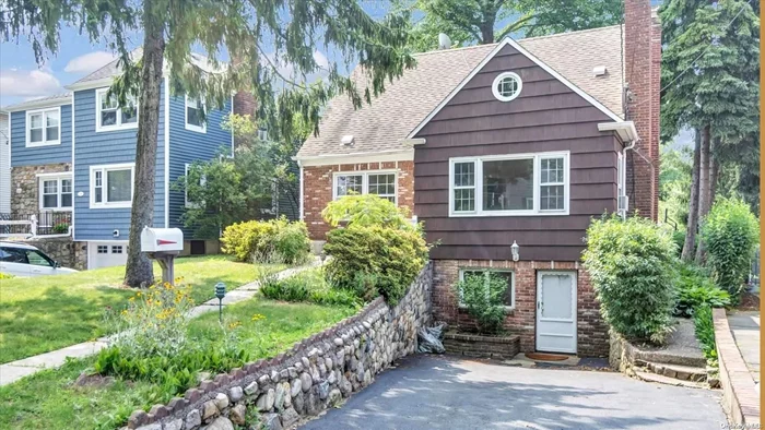 Charming 4 Bedroom, 2 Bath Cape Located in Manhasset Isle. Living room with wood burning fireplace. Fully finished basement with laundry and outside entrance.