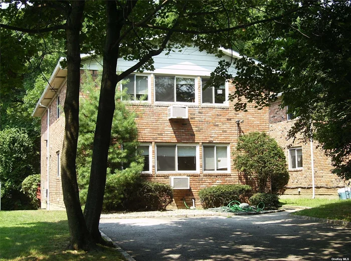 Renovated in 2021 this beautiful first floor apartment features a large Living Room/Dining Room, spacious EIK that is brand new and has a large pantry, three generously sized bedrooms and two brand new full baths. The kitchen features all new cabinets, Stainless steel appliances and quartz countertops.  Additionally there are hardwood floors throughout, new LED lighting, deck off of the Master Suite, private shared use of yard, large storage area in basement, four air conditioners in the apartment, washer/dryer in basement and off street parking for two cars. Must see!