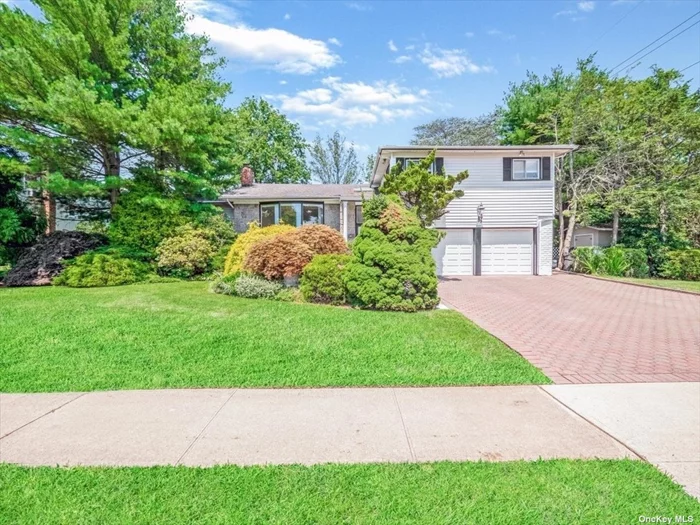 Majestic split house in the heart of the Jericho School District, West Birchwood, Jericho. Over 2600 sqft, huge 4 bedroom, 3.5 bathrooms, formal dining room, enormous eat in kitchen, family room/den with a gorgeous fireplace. You could be coming home to this one of a kind magnificent home sitting on an almost 14, 000sqft (.32 acres) lot and a resort-like gorgeous backyard with a marvelous heated in-ground pool perfect for entertaining.  Located near the Cantiague Park where you can enjoy tennis, golf,  an olympic-size pool and ice skating. Minutes from the LIRR Hicksville Station, shopping and dining.