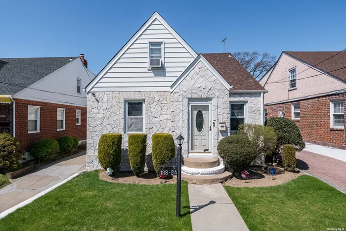 Welcome to this well maintained 4 BR brick Cape in the heart of Laurelton. This home features beautiful hardwood floors, updated Eik w/ Stainless appliances + Formal dining room. Updated bath, gas heat, full basement & crawl space for plenty of storage plus a one car detached garage with private driveway.