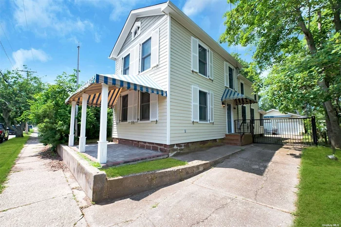 Beautifully Renovated Charming Greenport Village Antique 2 Story Home with Oversized Two Car Garage. Located in the Center of It All! Must See!