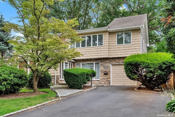 Located in a prime location in the highly desired Massapequa Park, this stunning 4 BR/3 BA colonial boasts an array of sleek finishes and an open plan layout. Featuring hardwood floors & tile throughout, high ceilings, wainscoting, central cooling & more! Perfect for entertaining, the eat-in kitchen is equipped with custom cabinetry, granite countertops, high-end appliances and flows into a spacious LR/DR. The upstairs features 3 bedrooms including a large master, additional living space & a full bath with a large vanity. The backyard features a large wood deck and plenty of yard space. Full finished basement with a full bath, laundry & outdoor entrance. Andersen windows & doors throughout. All renovations & siding done 13 yrs ago. HW Heater (8 y/o), 3 zone heat & CAC, 200 AMP electric panel, in-ground sprinklers in front & back. Roof (20 y/o). Do not miss!